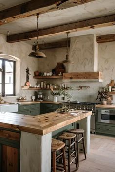 a kitchen with green cabinets and wooden counter tops