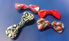 four different types of bow ties on a blue surface