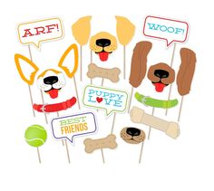 dog party photo booth props with dogs on sticks and speech bubbles in the shape of hearts