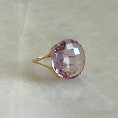 ITEM DESCRIPTION: >>The Ring is made from Solid 14K Yellow Gold. Gemstone used is absolutely natural and ethically sourced. >>Natural Pink Amethyst in round shape and briolette cut is studded on it with utmost precision. Gem: Pink Amethyst Gem size & shape: 18 mm and round Gem weight: 13.75 carat Gold purity: 14K (58.33% approx.) Gold weight: 1.73 grams Gross weight : 4.48 grams The Gold purity is guaranteed and it comes with authentic 14K gold hallmark. Since these Rings are handmade, they are Elegant Lavender Amethyst Ring In 14k Gold, Luxury Faceted Amethyst Ring For Formal Occasions, Luxury Faceted Amethyst Ring For Formal Events, Formal 14k Gold Amethyst Ring, Timeless Amethyst Ring As A Gift, Yellow Gold Amethyst Ring With Round Shape, Timeless Purple Rings Perfect For Gifts, Timeless Purple Rings For Gifts, Timeless Purple Rings As Gifts