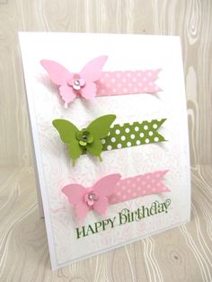 a birthday card with pink and green butterflies