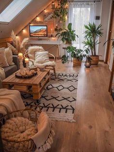 a living room filled with furniture and lots of plants on top of the couches