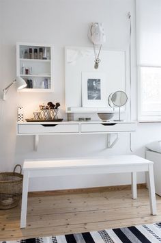 a white table and bench in a room