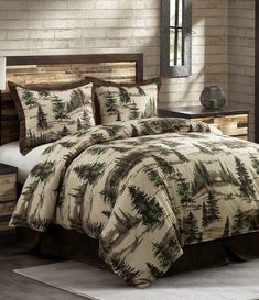 the comforter is made up with pine trees on it