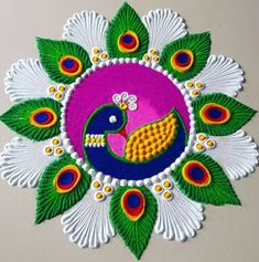 an intricately decorated wall hanging with peacocks and leaves in the shape of a circle