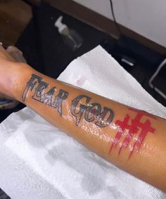 Fear None Tattoo Men, Fear God Tattoo Men, Fear God Tattoo, Simple Leg Tattoos, Fear Tattoo, Memorial Tattoo Ideas, Word Tattoo Ideas, Black Men Tattoos