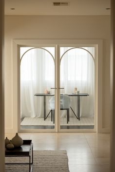 an open door leading to a dining room