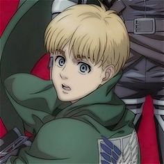 an anime character with blonde hair and blue eyes wearing a green hoodie looking at the camera