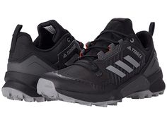 adidas Outdoor Terrex Swift R3 - Men's Shoes : Black/Grey/Solar Red : Fast on any hike, the adidas Outdoor Terrex Swift R3 combines the lightweight design and cushioning of a trail running shoe with the versatility and stability of a hiking boot. Textile and synthetic upper with a lace-up style and heel pull tab. Padded tongue and collar for added comfort. Textile lining and insole. Molded sockliner with a Lightstrike EVA midsole. Rock protection plate and reinforced heel support. Signature thre Functional Adidas Lace-up Trail Running Shoes, Adidas Functional Trail Running Shoes, Adidas Low-top Trail Running Shoes For Hiking, Adidas Low-top Trail Running Shoes For Sports, Adidas Functional Running Shoes For Outdoor, Functional Adidas Running Shoes For Hiking, Adidas Logo Outdoor Sneakers In Synthetic Material, Functional Adidas Hiking Running Shoes, Outdoor Adidas Logo Synthetic Sneakers