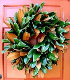 a wreath is hanging on the front door