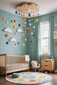 a baby's room with blue walls and stars on the ceiling