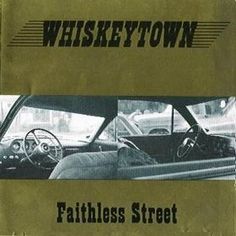 an old book with the title'whiskey town'written in black and white on it