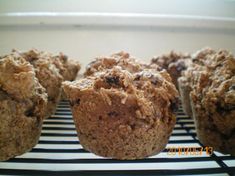 several muffins are sitting on a cooling rack