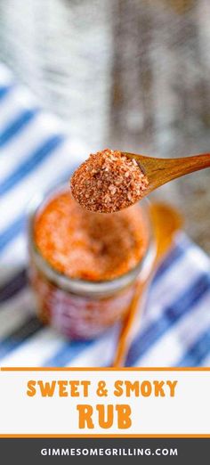 a spoon full of sweet and smoky rub on top of a striped napkin with text overlay