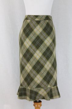 "Vintage BCBG MaxAzria green paid tweed skirt Acrylic, polyester and wool blend tweed with acetate lining Shades of green with light blue and yellow accents Bias cut straight pencil skirt with a fishtail hem From the early 1999 2000 Excellent condition Size tag has been removed but measures to a size  USA 6- Small Size 6 USA Great Britain 10 France 38 Germany 36 Italy 42 Measures: length 23\" waist 28 Hips 40\"" Fitted Green Tweed Dress For Fall, Fitted Tweed Skirt With Lining, Fitted Tweed Lined Skirt, Fitted Green Pencil Skirt For Fall, Fitted Tweed Pencil Skirt, Green Fitted Skirt For Fall, Fitted Green Skirt For Fall, Tartan Pleated Skirt, Tartan Skirt