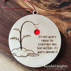 a wooden ornament with a quote on it