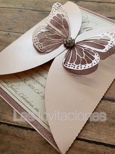 a close up of a card with a butterfly on it's front and back