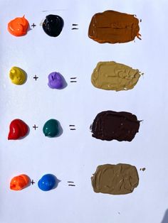 several different colors of paint on a white surface