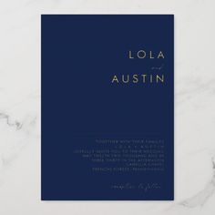 a blue wedding program with gold lettering on it