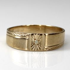 a gold ring with a diamond in the center