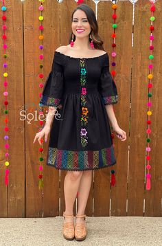 This Beautiful Dress boasts a Traditional Mexican floral design combined with a modern style dress. The elastic bodice combined with the bell sleeves makes it fun and flirty. It's made out of fine Mexican cotton and has elastic around the top for a tighter fit. This dress is handmade and hand embroidered by Mexican Artisans in Oaxaca, Mexico. This dress comes in one size: Small/Medium Purchase the shoes modeled here: https://www.etsy.com/es/listing/830412617/tacon-artesanal-de-bloque-zapato?ref= Black Bell Sleeve Summer Dress, Black Bell Sleeve Dress For Summer, Bohemian Fitted Dress With Embroidered Sleeves, Fitted Bohemian Dress With Embroidered Sleeves, Spring Bell Sleeve Embroidered Dress, Spring Embroidered Bell Sleeve Dress, Mexican Party Dress, Frida Kahlo Dress, Dress Bell Sleeve