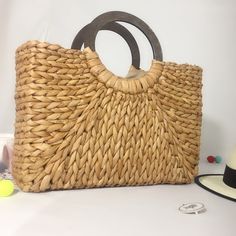 Rattan Liesure Bag has a bamboo handle and a polyester cotton inner lining bamboo handle Size: Upper mouth width 42cm, bag height 25cm, total height 35cm (including handle), bag thickness 12cm Eco-friendly Straw Bag For Shopping With Top Carry Handle, Casual Natural Satchel With Top Handle, Casual Beach Bag With Bamboo Handle For Travel, Top Handle Hobo Bag With Leather Handles For Beach, Eco-friendly Bucket Bag With Bamboo Handle, Eco-friendly Top Handle Bucket Bag With Bamboo, Beach Hobo Bag With Leather Top Handle, Beach Hobo Bag With Top Handle And Leather Details, Summer Natural Hobo Bag