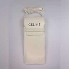 Pre-Owned Celine Smooth Calfskin Sunglasses Pouch *Used Twice Still Like New Condition* *No Longer Have The Box* *No Sunglasses Come Included With This Pouch* Base Length: 3.25 In Height: 7.75 In Width This Elegantly Simple Pouch Is Versatile And Functional And Is Crafted Of Smooth Calfskin Leather In White. This Case Features The Celine Logo In Black And Opens To A Black Fabric Interior. Celine Logo, Simple Pouch, Sunglasses Pouch, Celine Bags, Black Fabric, Cosmetic Bag, Calf Skin, Pouch, Sunglasses