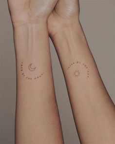 two wrist tattoos with the sun, moon and stars tattooed on each one side of their arms