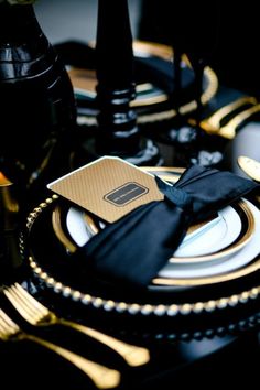 black and gold table setting with place settings