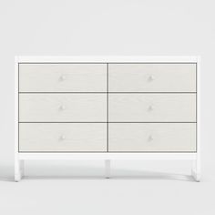 a white dresser with four drawers