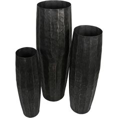 three black vases sitting next to each other