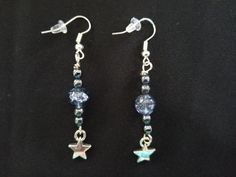 pair of earrings with star and crystal beads