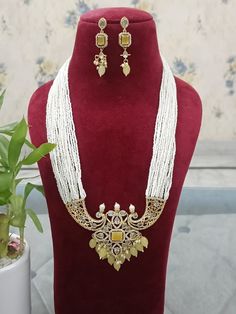 A Gift for someone most adorable for you. Suitable for all kind of outfits like lehenga, dresses, sarees . Necklace : 1 Earring:  1 Kundan Pearl Necklace With Meenakari For Puja, Kundan Pearl Necklace With Cutdana For Puja, Kundan Pearl Necklace For Diwali Celebration, Diwali Pearl Necklace With Meenakari, Temple Jewelry Chandbali Pearl Necklace For Party, Long Kundan Necklace For Party, Chandbali Pearl Necklace With Tilla For Festivals, Bollywood Style Kundan Necklace With Pearl Chain For Parties, Kundan Meenakari Temple Necklace For Party