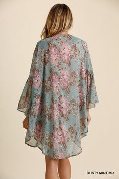 Treat yourself to soft floral comfort with this billowing hi-lo kimono cardigan. The open front and flowing bell sleeves create an effortlessly breezy style, ideal for lazy Sunday morning coffees or cozy movie nights in. The curved hemline and pretty floral print add a touch of feminine charm without saccharine sweetness, instantly elevating the most mundane of everyday outfits. 100% Polyester Want to view this on the *Live* Sizing & Styling Guide?! Watch it in the photo section above! *You will Flowy V-neck Cardigan For The Beach, V-neck Floral Print Kimono For Fall, Bohemian V-neck Cardigan For Loungewear, Flowy Floral Print Kimono For Fall, Flowy Long Sleeve Kimono With Floral Print, Bohemian V-neck Cardigan With Floral Print, Fall Vacation Kimono With Floral Print, Floral Print Fall Kimono For Vacation, Floral Print V-neck Kimono For Fall