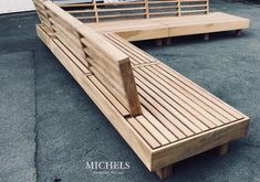 two wooden benches sitting next to each other