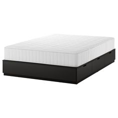 an image of a mattress with no sheets on it's head and footboard