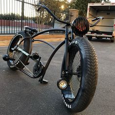 an unusual looking bike is parked in the parking lot