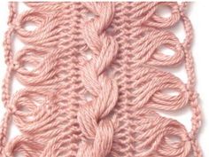 a pink crochet stitch on a white background