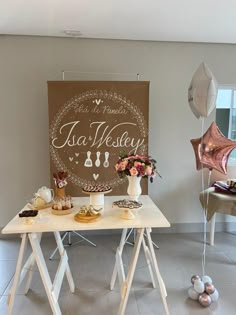 a table topped with lots of desserts next to a sign that says it's a wedding