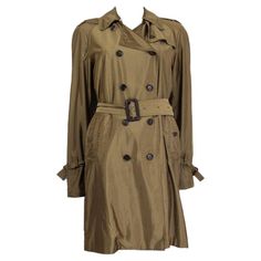 Gucci iridescent double-breasted trench coat in olive green polyamide (58%) and polyester (42%) with a flat collar, epaulettes, buttoned slit pockets and belted cuffs. Comes with a brown leather buckle matching belt. Closes on the front with buttons. Partially line in viscose (57%) and polyester (43%). Has been worn and is in excellent condition. Sleeves have been measured from the neck. Tag Size 42 Size M Shoulder Width 38cm (14.8in) Bust 96cm (37.4in) Waist 94cm (36.7in) Hips 96cm (37.4in) Len Double Breasted Trench Coat, Flat Collar, Leather Buckle, Double Breasted, Olive Green, Brown Leather, Trench Coat, Coats Jackets, Sleeve Length