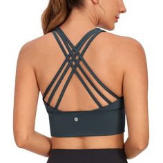 PRICES MAY VARY. Designed for yoga and training. Medium support. Sleek, sweat-wicking fabric with decent compression, so comfortable and 4-way stretch. Wireless yoga bras with removable pads. Scoop neckline. Strappy back provides extra support. Longline design provides more coverage and stability. Built for comfort and low/medium support, this yoga bra has strappy back design for full freedom of movement and a stylish look.
 It's made of soft moisture-wicking fabric and it hugs the body with a g Womens Half Zip Pullover, Yoga Bra Tops, Yoga Crop Tops, Crz Yoga, Sport Bras, Pilates Yoga, Strappy Sports Bras, Longline Bra, Soft Bra