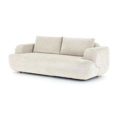 a white couch with two pillows on it