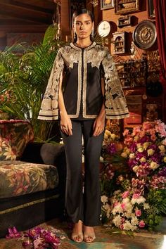 Black cape style jacket with all over contrast floral applique, sequin, pearl, dori and zari hand embroidery. Paired with boot-cut pant. - Aza Fashions Applique Jacket, Cape For Women, Wild Leopard, Black Cape, Leopard Print Leggings, Cape Style, Cape Sleeves, Leggings Set, Indian Attire