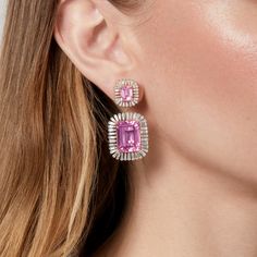 Earrings measure 1 1/2" in length. Top portion of earrings measures 15mm x 13mm. Bottom portion of earrings measures 25mm x 21mm. Pink Topaz is synthetic. Sold with Chrysmela Backings. SKU ASEY5795-PT Carat Weight 36.86ct Pink Topaz || 3.32ct Baguette Diamond Metal Type 18KT Yellow Gold Number of Stones 4 Pink Topaz || 120 Baguette Diamonds Primary Stone Pink Topaz Metal Weight 12.65g Formal Baguette Diamond Rectangular Earrings, Formal Rectangular Baguette Diamond Earrings, Gia Certified Pink Fine Jewelry Earrings, Luxury Rectangular Gemstone Earrings, Fine Jewelry Gemstone Baguette Cut Earrings, Fine Jewelry Baguette Cut Gemstone Earrings, Fine Jewelry Pink Baguette Diamonds, Rectangular Diamond Jewelry With Matching Earrings, Fine Jewelry Baguette Cut Earrings For Pierced Ears