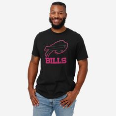 When your team shines bright, you should too! Get ready to glow on gameday with the Buffalo Bills Highlight Reel T-Shirt. Features All-over black and neon design: This t-shirt is dark with highlighted features so you can shine bright on gameday and everyday Team logo display with highlight outline: The front of this apparel features a black team logo display outlined in neon pink, and a neon pink wordmark team name display so you can show off your team spirit with pride Crew neck rib collar: Thi Black T-shirt With Team Logo For Game Day, Black T-shirt With Screen Print For Fan Gear, Black Fan Apparel T-shirt With Team Name, Black T-shirt With Team Name For Fans, Black Short Sleeve T-shirt For Sports Fans, Black Sports Fan Top With Screen Print, Buffalo Bills Apparel, Logo Display, Neon Design