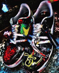 a pair of shoes with graffiti on them