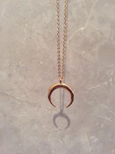 This listing is for one Crescent Moon Pendant Necklace. The pendant and chain are gold plated stainless steel and tarnish resistant. Gold Crescent Brass Jewelry, Nickel-free Gold Crescent Jewelry, Gold Moon Charm Metal Jewelry, Gold Moon Charm Jewelry In Metal, Gold Jewelry With Moon Charm In Metal, Gold Moon-shaped Metal Jewelry, Gold Stainless Steel Necklace With Moon Charm, Gold Half Moon Shaped Metal Jewelry, Gold Moon Necklaces Tarnish Resistant