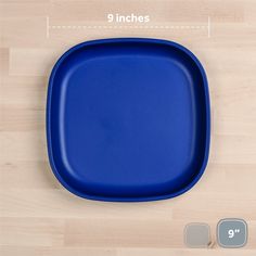 a blue plate sitting on top of a wooden table