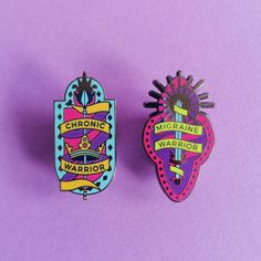 two pin badges sitting on top of a purple surface with the words chronic and warrior