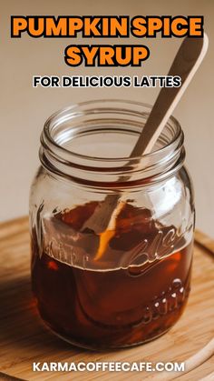 pumpkin spice syrup for delicious lattes in a mason jar on a cutting board with text overlay